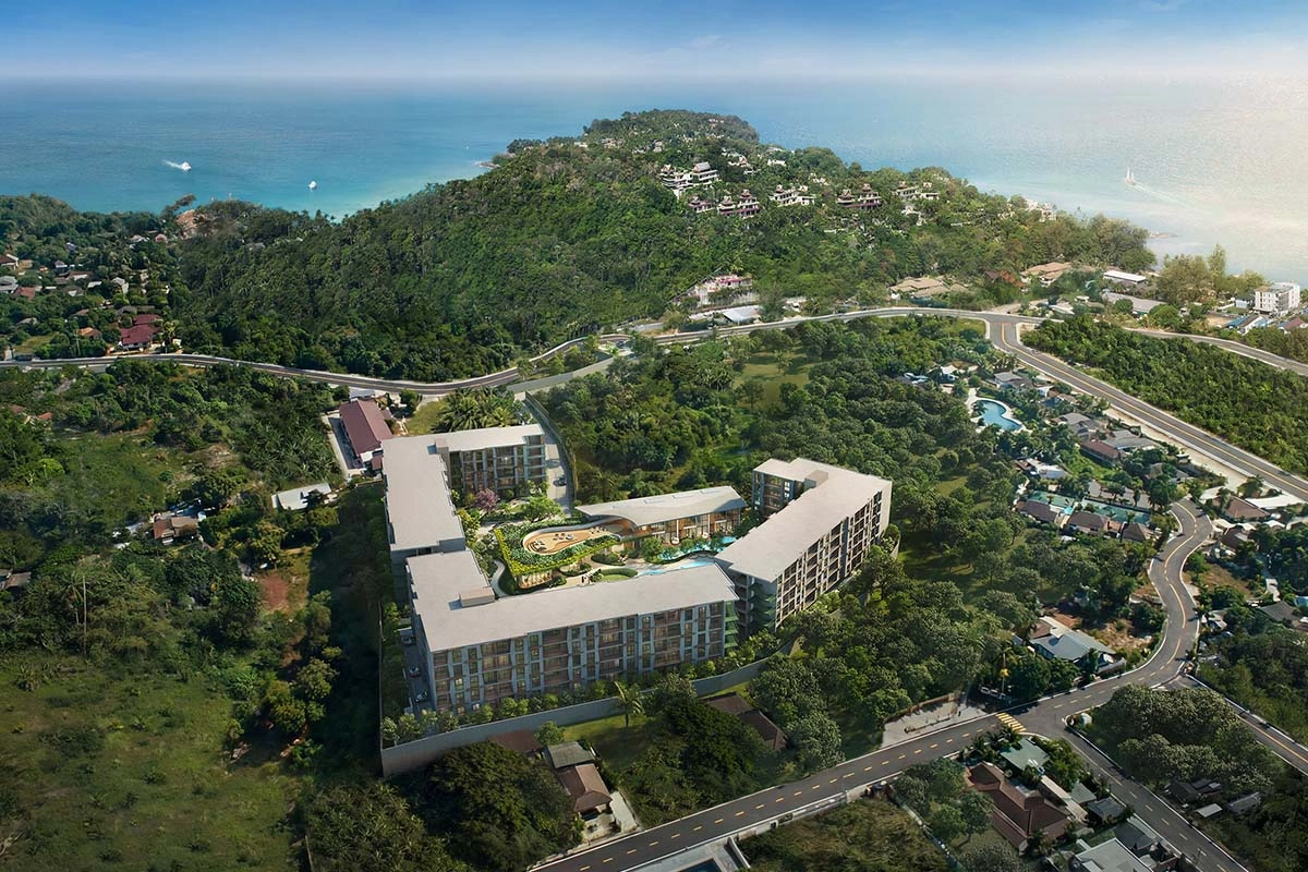 The buildings from above: three 5-storey volumes around the garden and pool, with the road and greenery at the edge of the plot