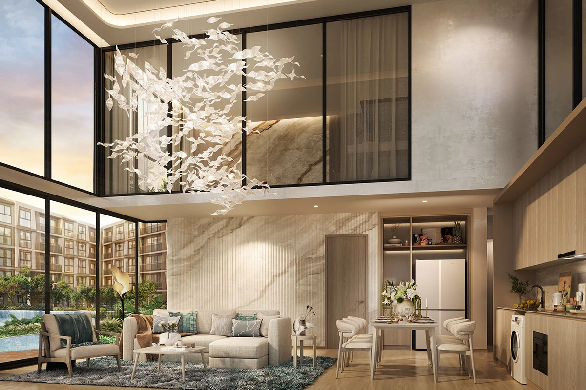 A villa's double-height living room: a chandelier of glass birds, a kitchen with a washing machine and windows onto the pool
