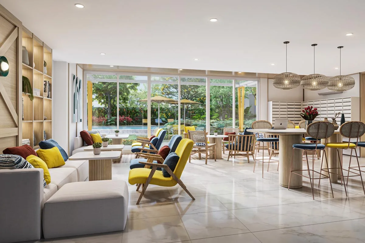 The Co-Living Area: sofas and armchairs by the windows onto the garden, then high tables with bar stools and hanging wicker lamps