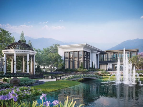 The clubhouse by the water: a rotunda, a bridge over the pond and fountains, with the mountain ridge behind