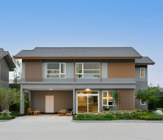 A house: grey render, a timber screen on the upper floor and a carport at the entrance