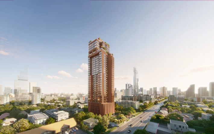 The tower seen from Nang Linchi: thirty-four storeys above a low-rise district, with the downtown skyline behind