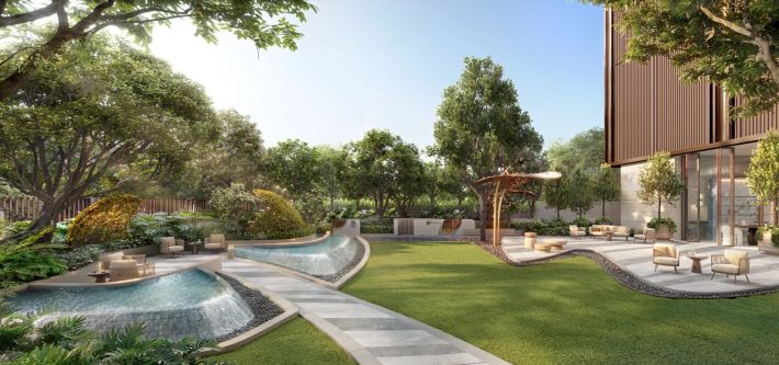 The garden below: the pool basin, lawn and pergolas between the building and the boundary