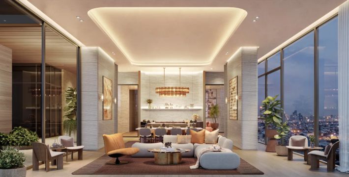 The lobby lounge: seating groups by the full-height window, the city beyond