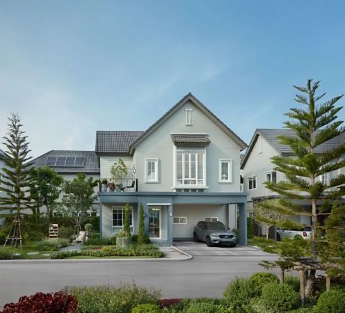A house from the street: a gabled roof, vertical cladding, a car under the canopy