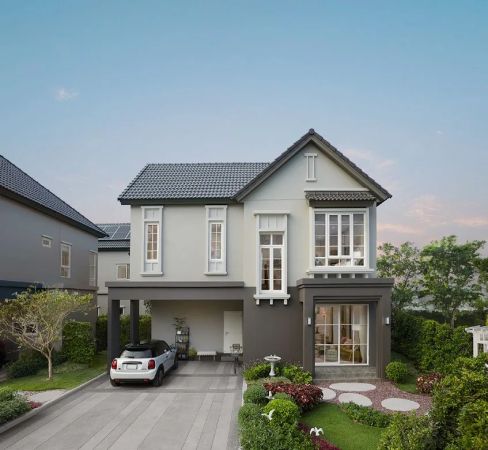 Another house type: a dark volume on the left, a light one on the right, a front garden