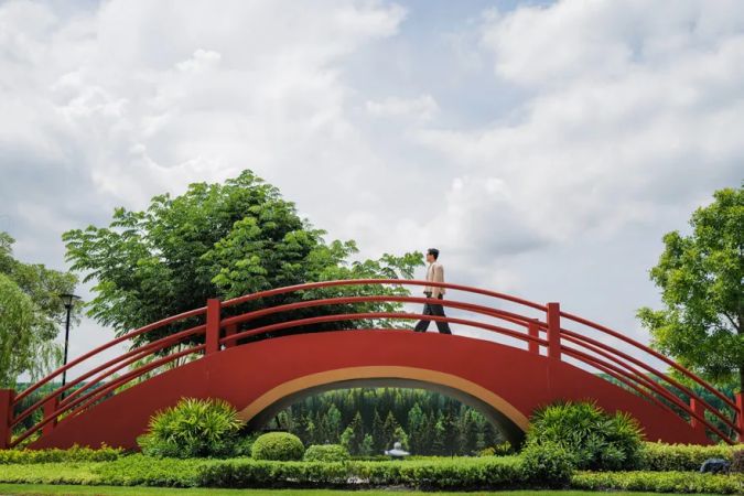 The red bridge over the water in the common area