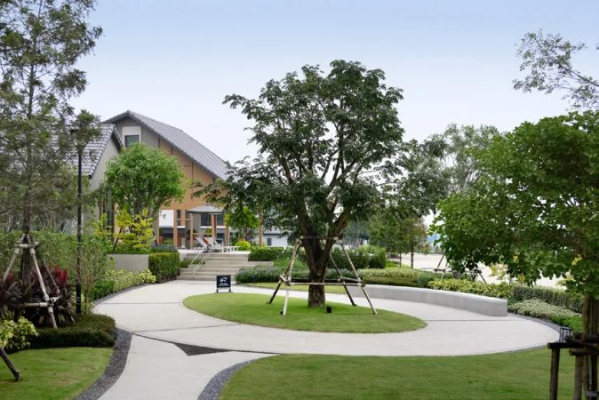 The park zone: a tree, swings and a path around the lawn