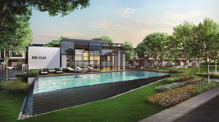The clubhouse and pool along the lawn