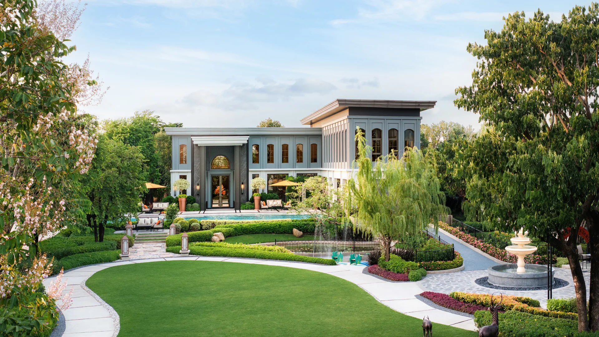 The clubhouse and pool amid the lawn