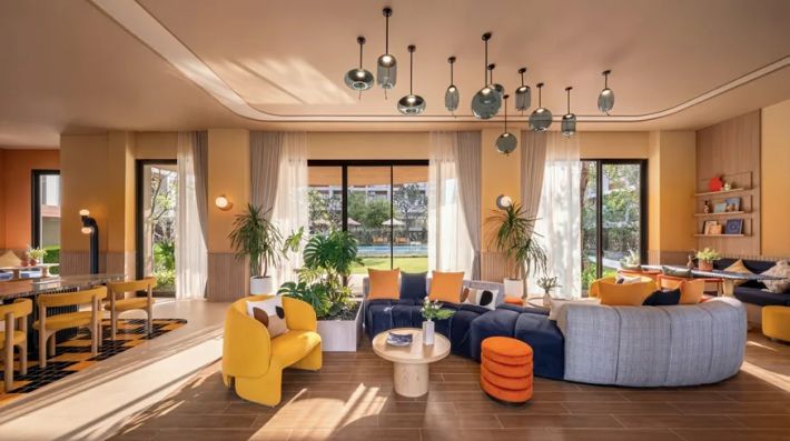 The lobby lounge: sofas, dining tables and the way out to the poolside terrace