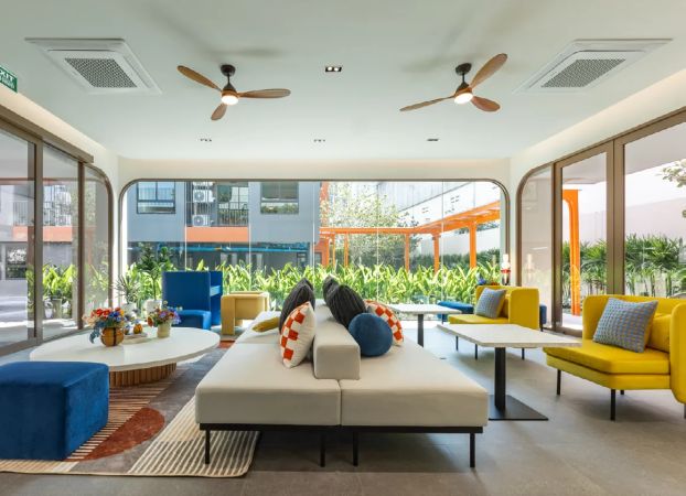 The lounge with ceiling fans, opened out to the garden
