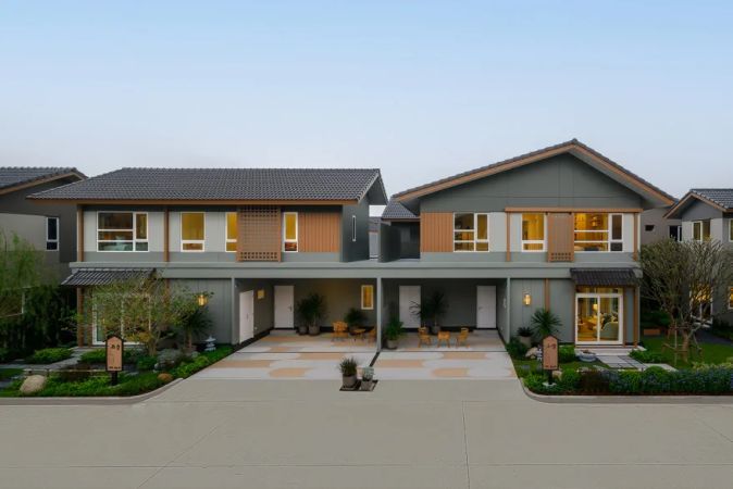 A row of houses with timber screens and deep eaves