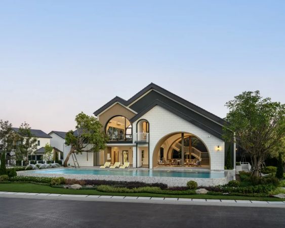 The clubhouse with its large arch and glazed façade