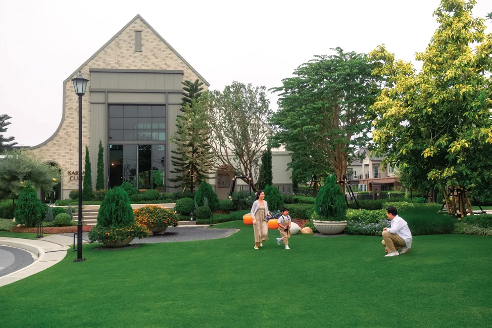 The clubhouse with its tall gable above the lawn