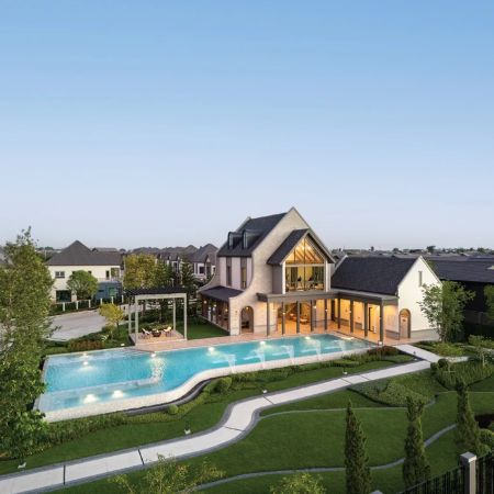 The clubhouse and pool from above, the development beyond