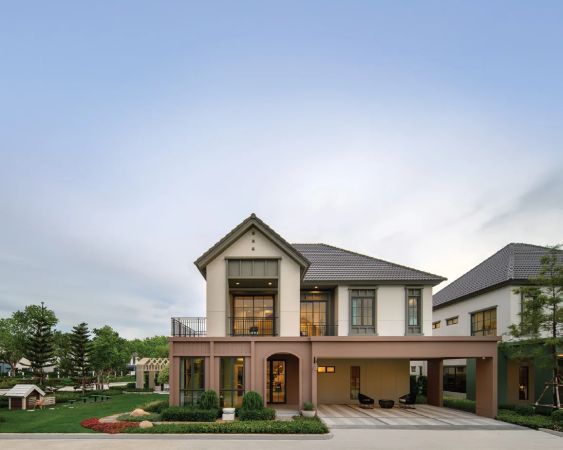 A house with a pitched roof and a ground-floor terrace
