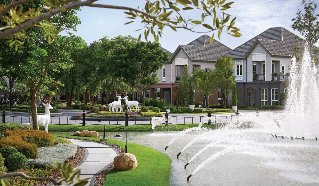The development's park with its fountain, houses on the far side