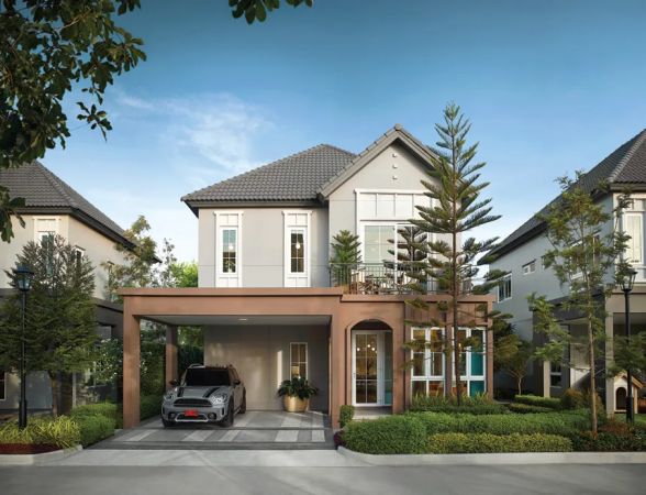 A house with a two-car carport and a pine by the entrance