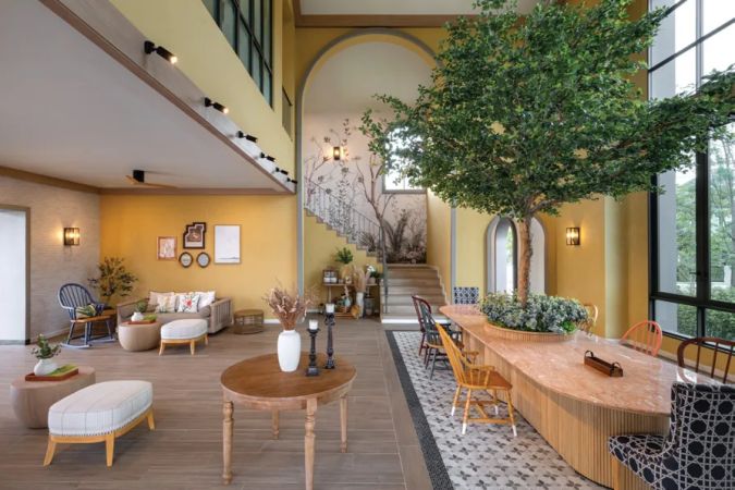 The clubhouse lounge with a potted tree