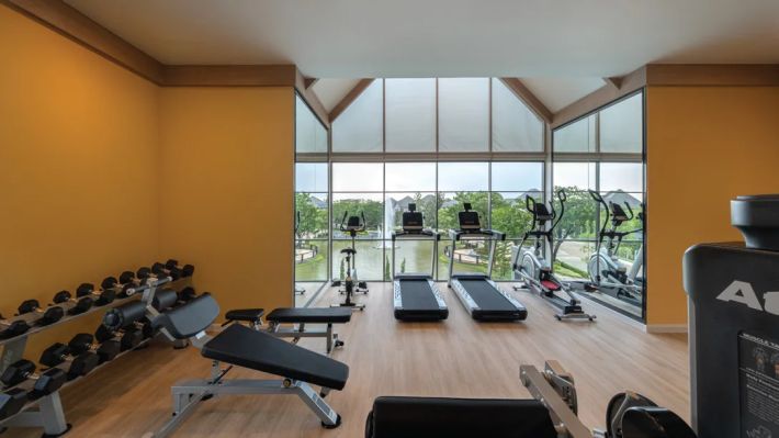 The gym with machines by the panoramic window
