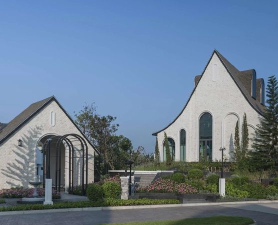 The clubhouse close up: a tall gable and an arched entrance