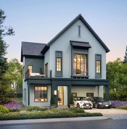 A dark-green house with a car under the carport