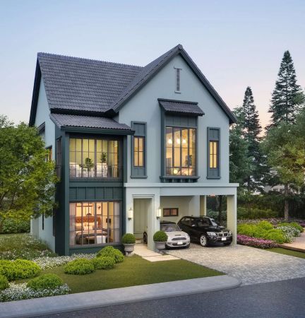 A house with an open first-floor terrace in the evening