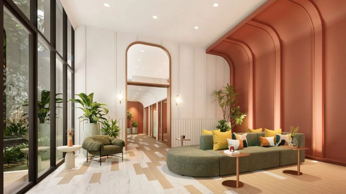The lounge with its arched opening and soft sofas