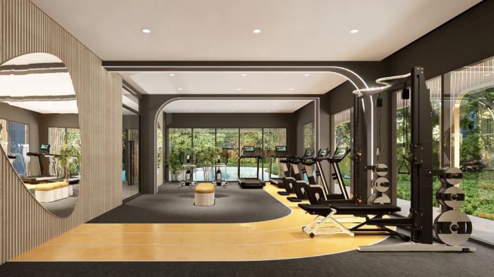 The gym with machines by the panoramic window