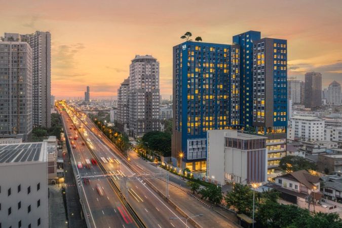 The building above the expressway at dusk