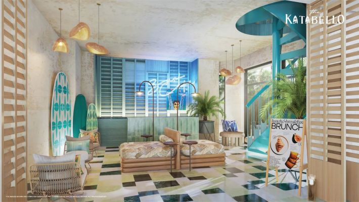 The lobby as a surf cafe: boards by the wall, a spiral stair, a brunch sign