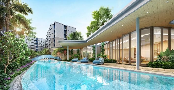 Lap pool and the clubhouse with a glass facade