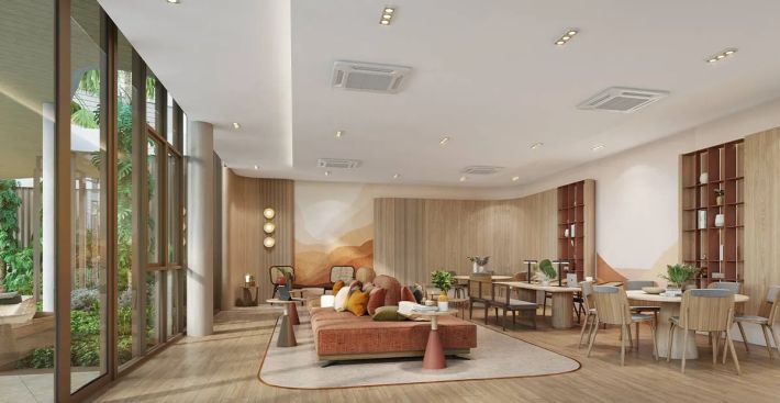 Co-working: desks and a lounge area by the full-height window