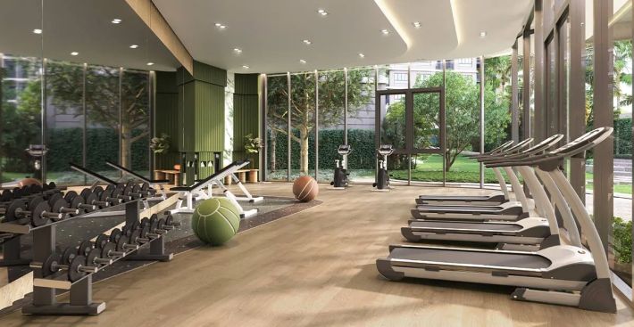 Fitness room: treadmills and free weights, full-height glazing