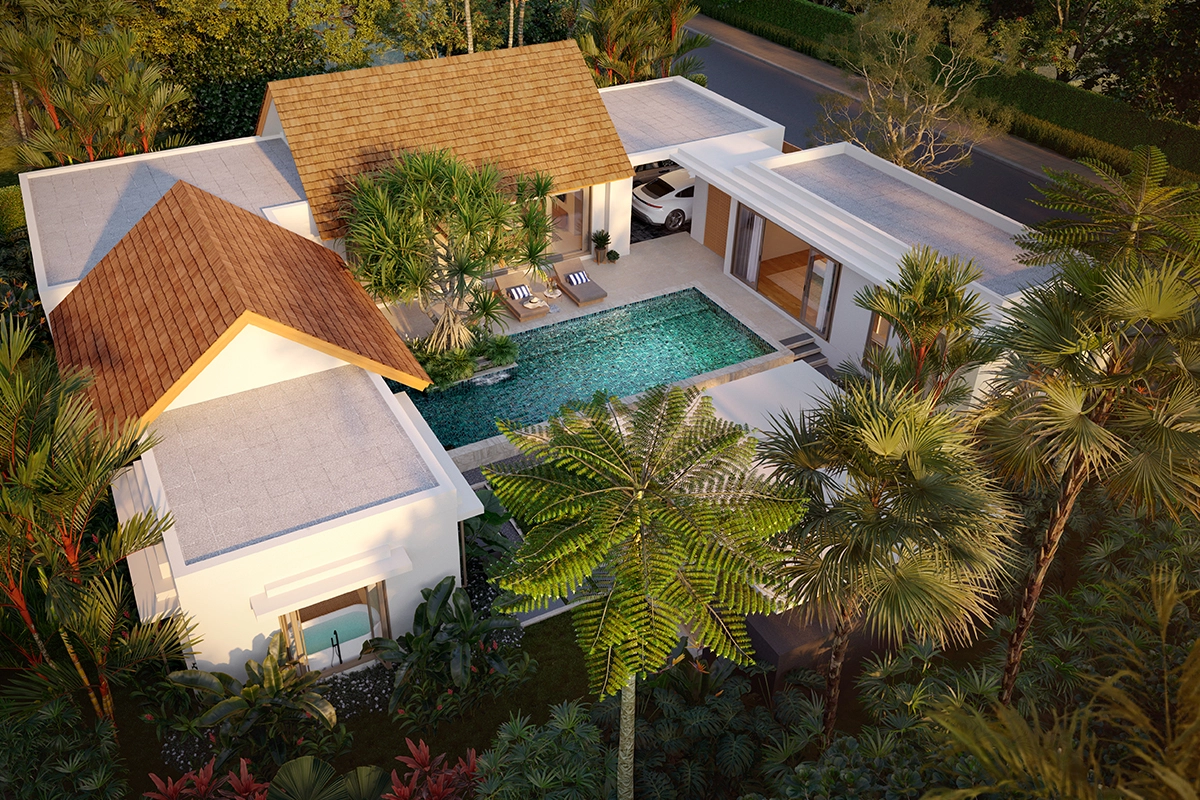 A villa from above: two wings under pitched shingle roofs, the pool and the carport between them