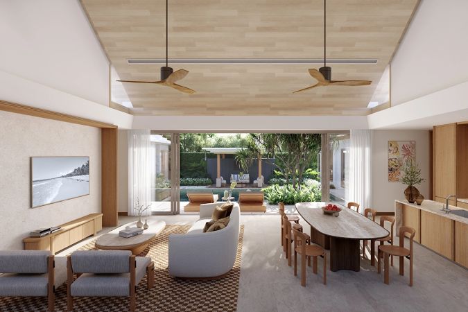 The living and dining room under a timber ceiling with two fans, the sliding wall open onto the pool