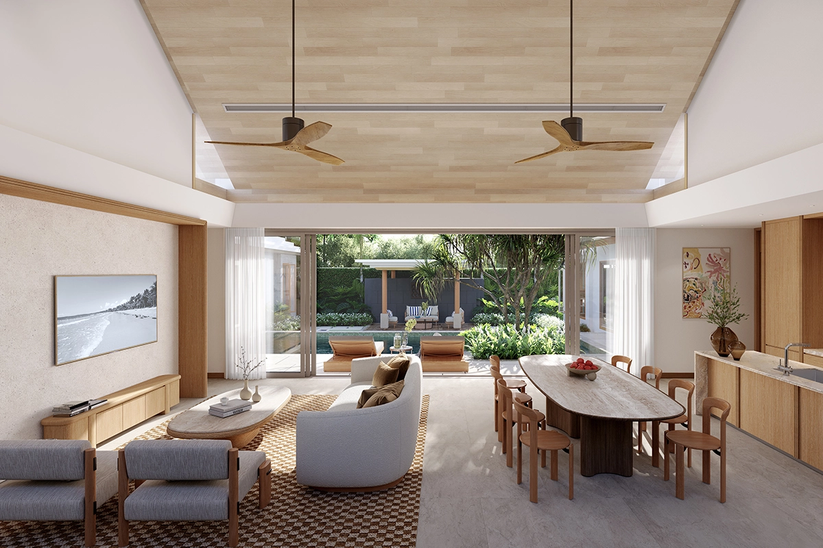 The living and dining room under a timber ceiling with two fans, the sliding wall open onto the pool