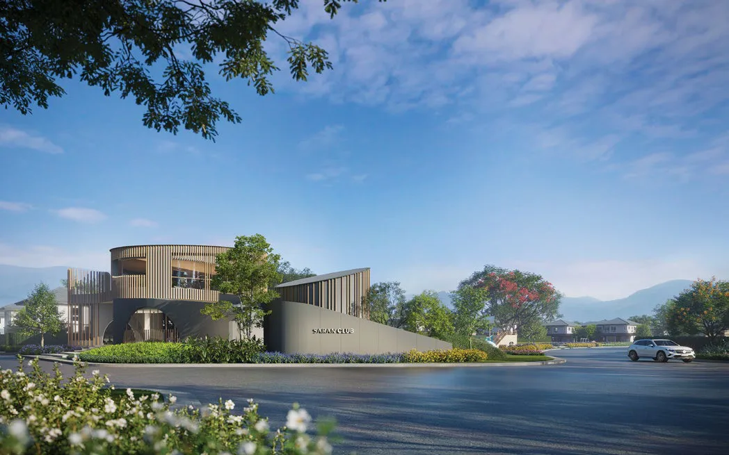The entrance: the round two-storey clubhouse with vertical louvres and a wall carrying the SARAN CLUB sign