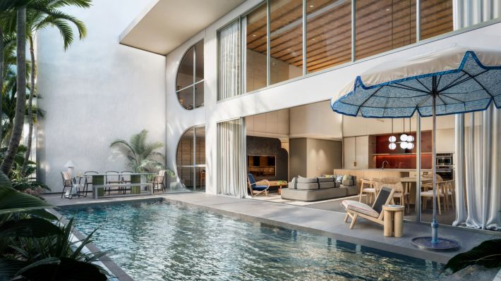 The duplex's own pool on the terrace, right up against the double-height living room